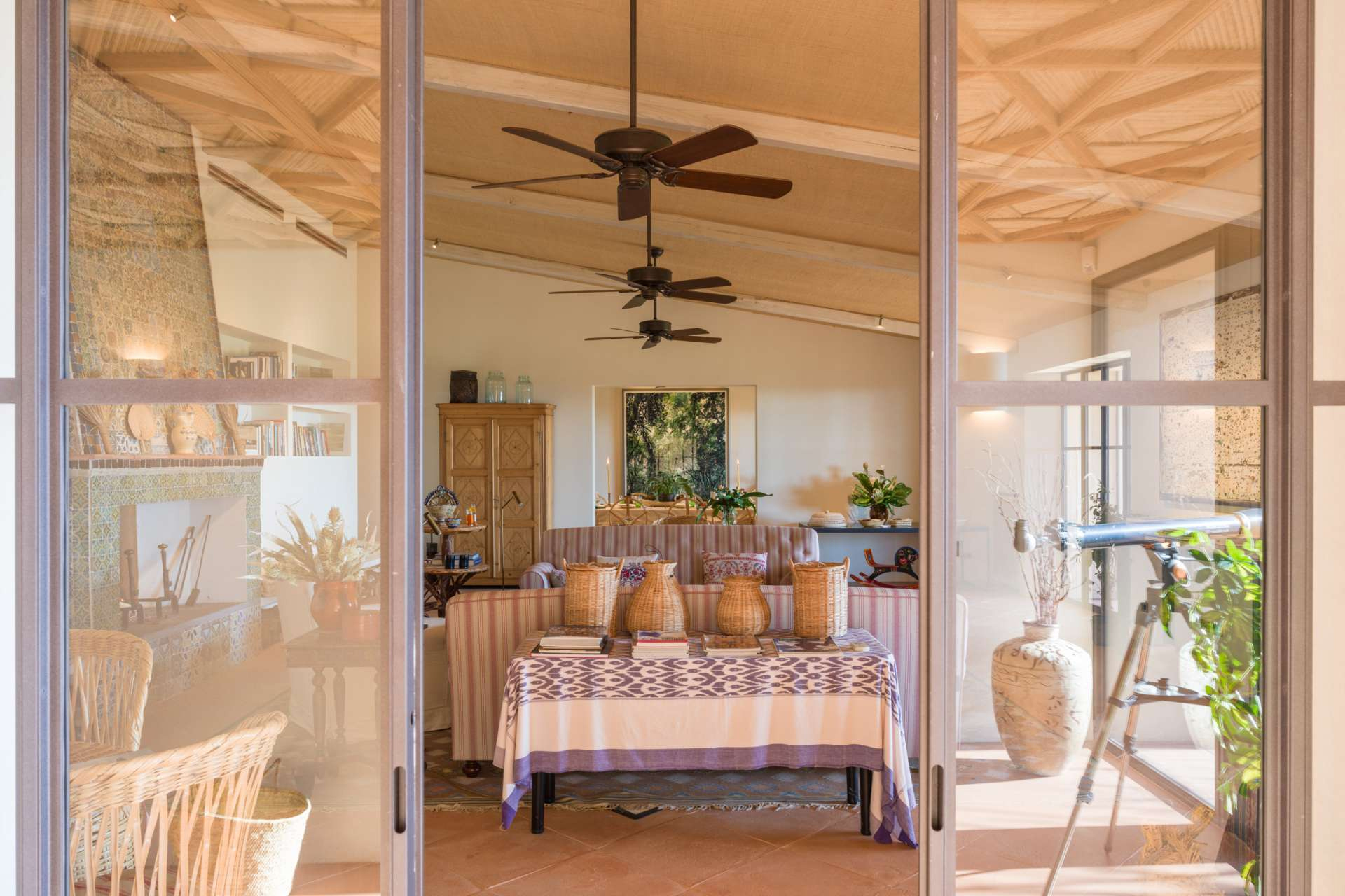 Sartomare Glass doors open onto the shaded alfresco dining and living area.