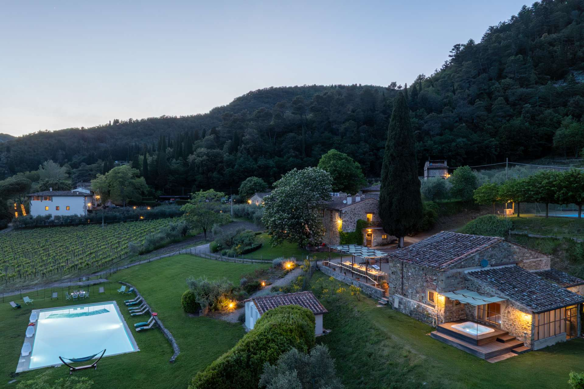 The Estate of Petroio with Staff and Cook Il Borgo glows warmly as evening settles across the estate