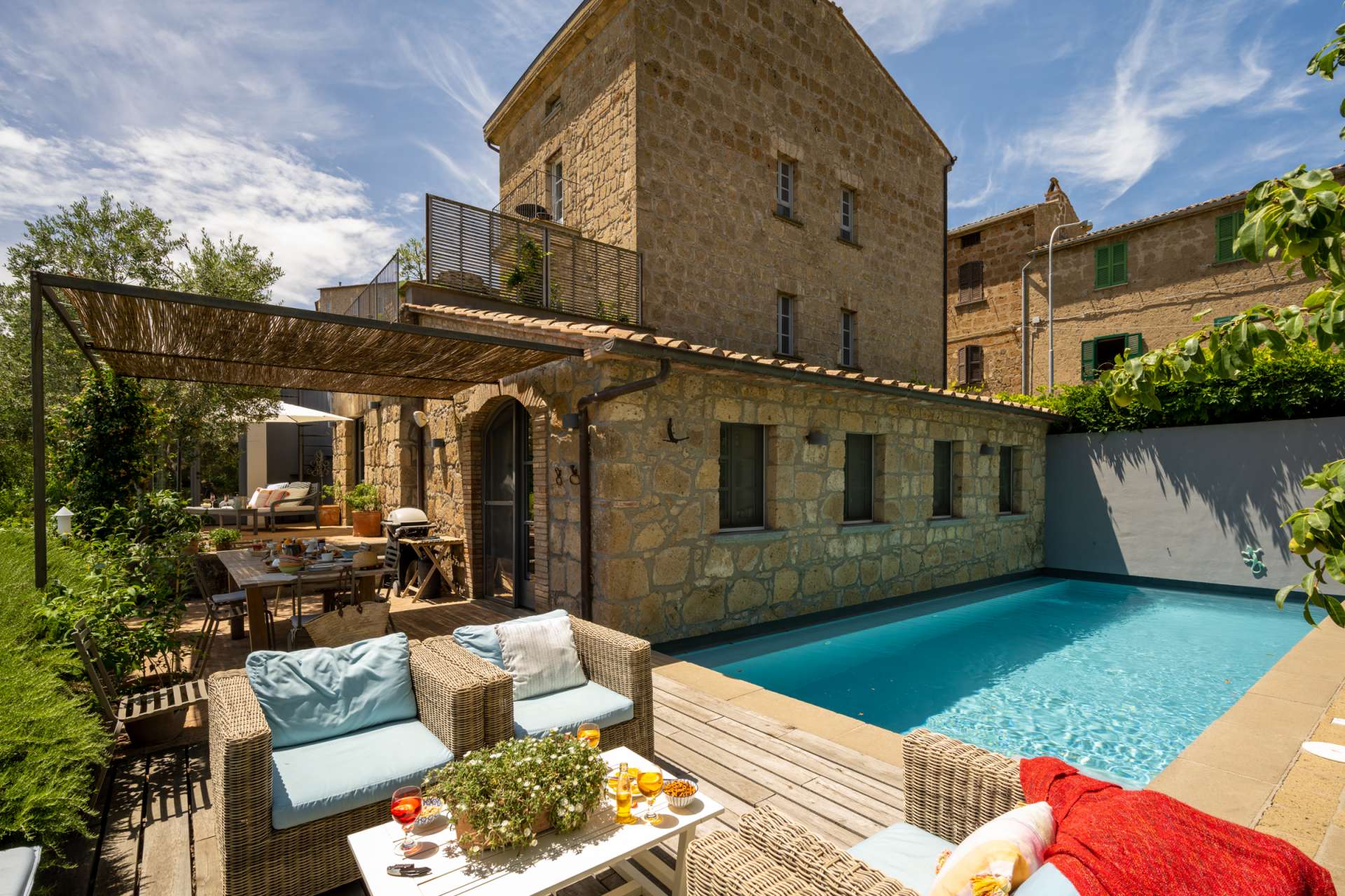 La Ciambella villa in Umbria, Italy – stone farmhouse with private pool, terrace and outdoor lounge area.