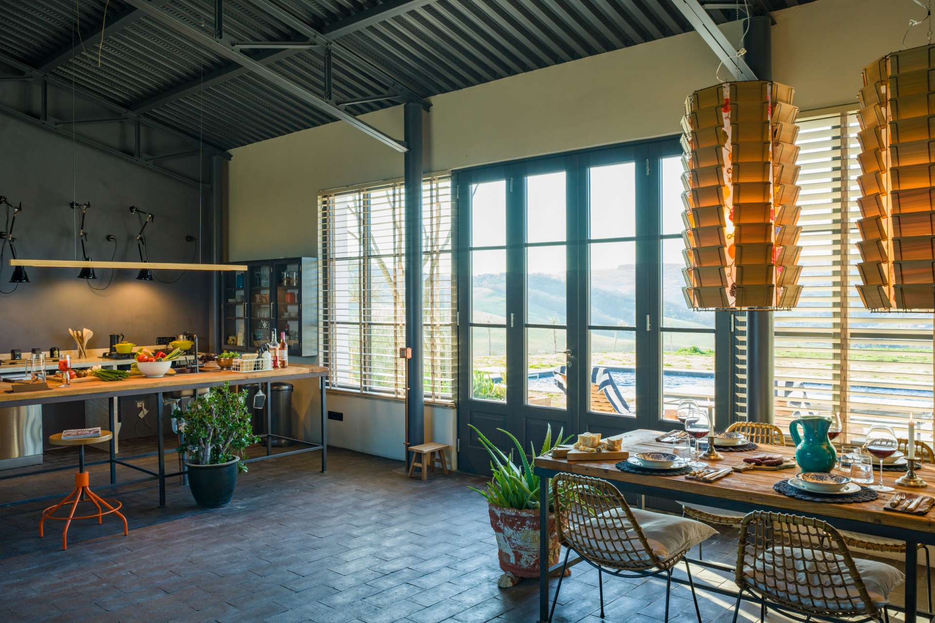 Poggarone The dining and kitchen area are both complete with upcycled rustic tables