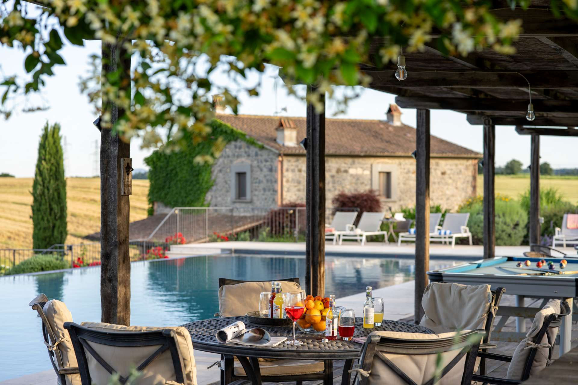Segreto Gelsomino Tranquil shaded seating area by the poo