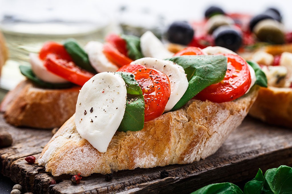 Bruschetta with tomatoes, mozzarella and basil