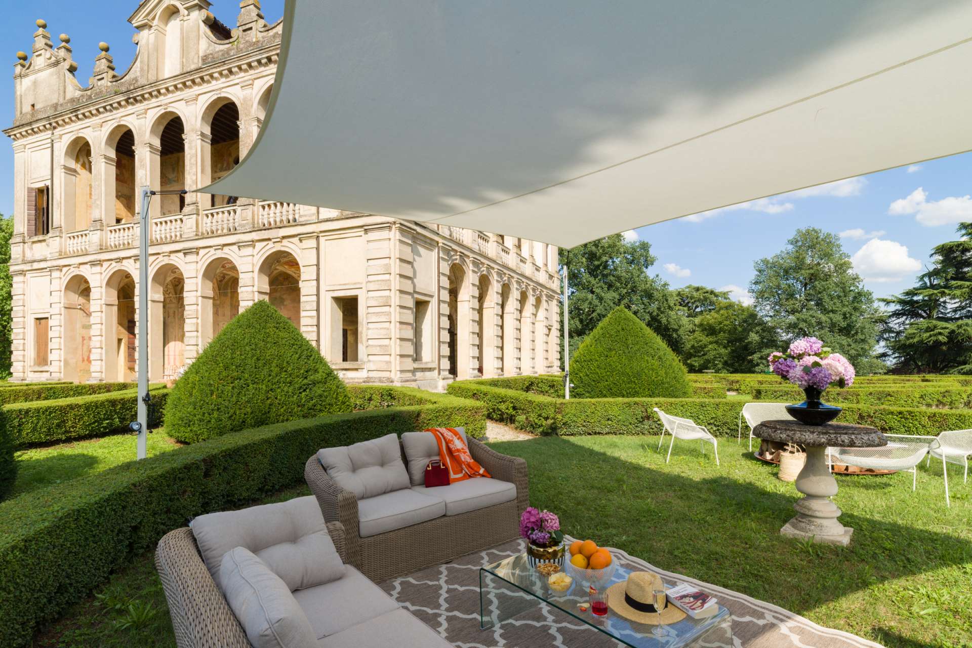 Luxury historic villa gardens at Ca’ di Lista in Tuscany Luxury historic villa in Tuscany with elegant formal gardens and outdoor lounge area at Ca’ di Lista, Italy