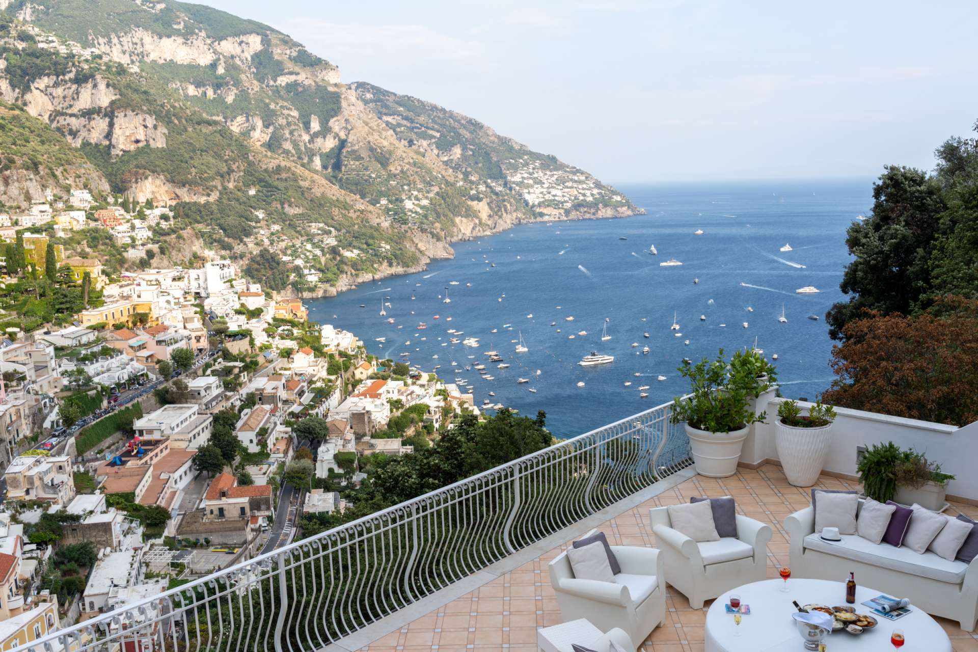 Terrace at Fraloga with panoramic views of Positano and the sea on the Amalfi Coast.