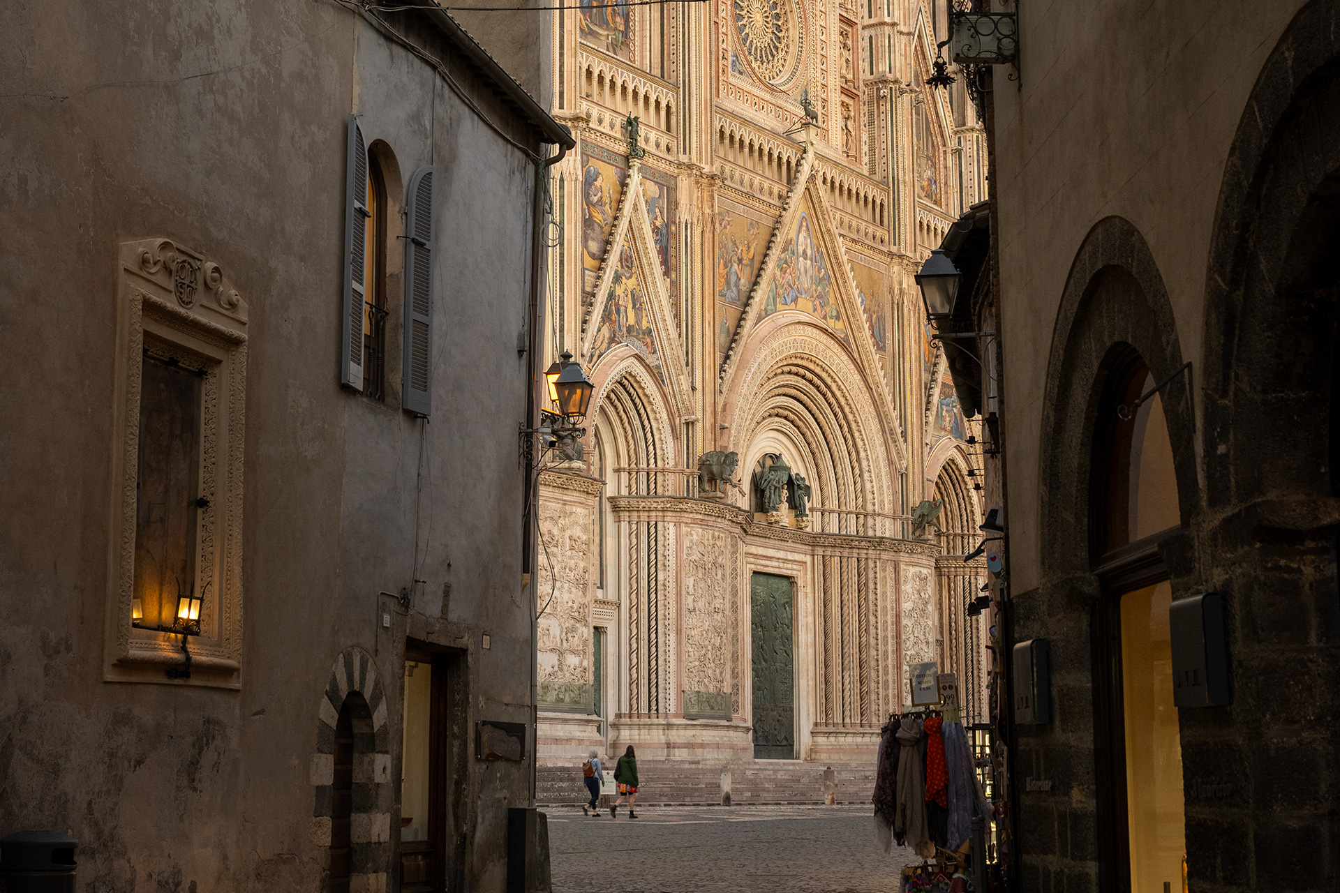 View of Orvieto Cathedral facade from a narrow medieval street in Orvieto, Italy