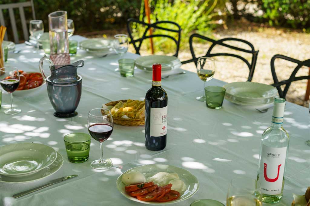 Table with wine and food in a villa in Chianti