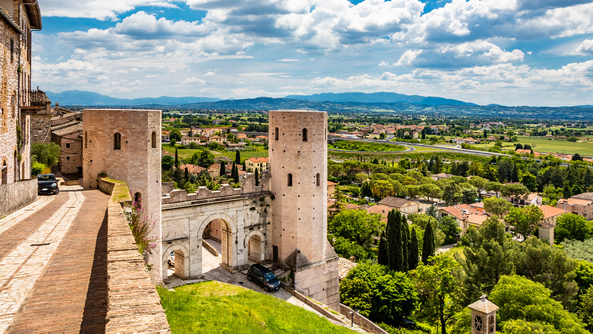 Medieval gate and defensive towers of Spello, Umbria, overlooking the surrounding countryside
