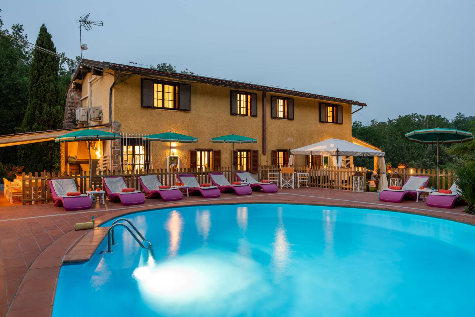 Discover Villa Denise in Tuscany: a luxury hillside villa near the coast with private spring-water pool, tennis court, spacious interiors and ideal group getaway.