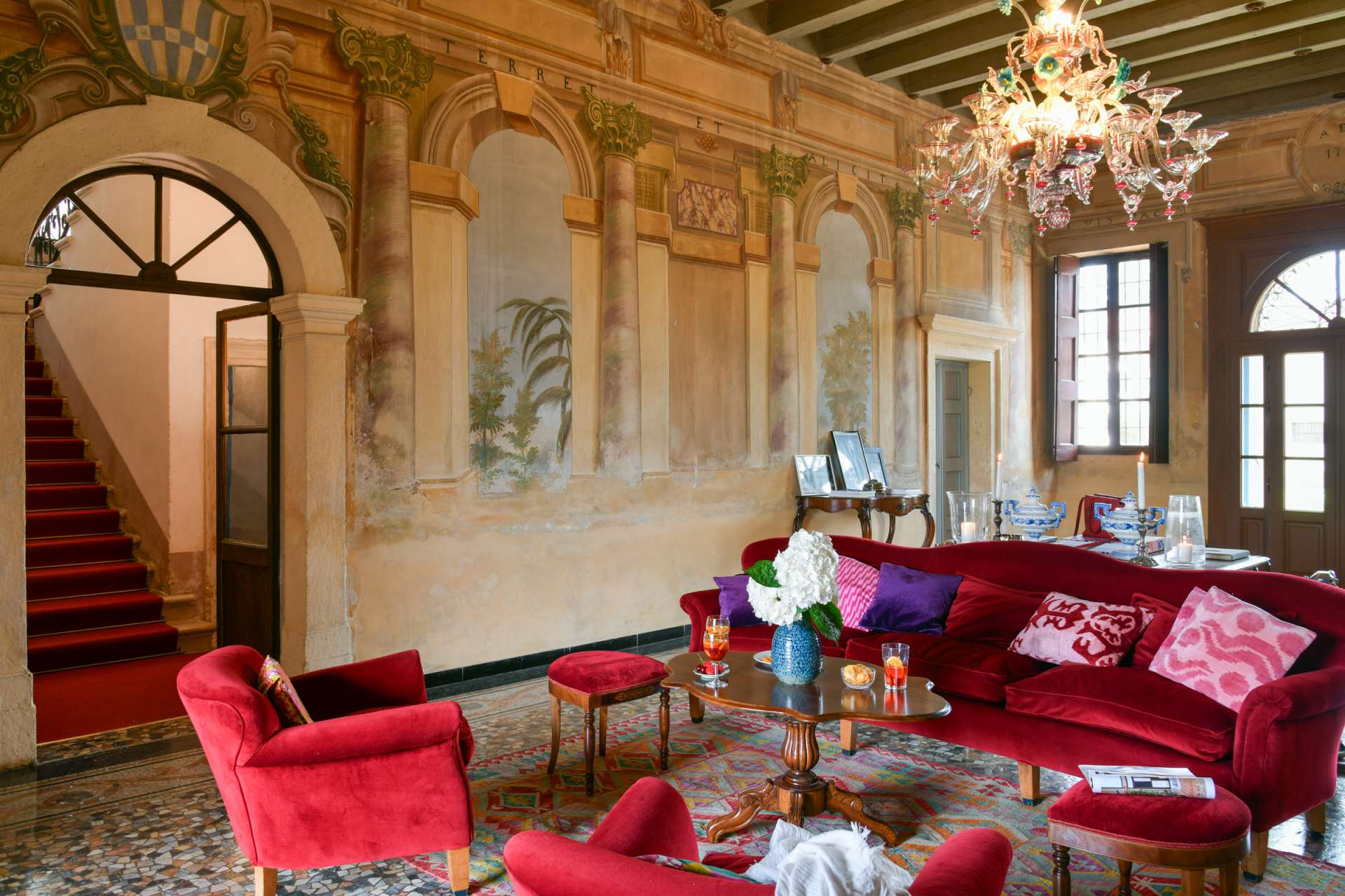 Villa Zambonina The spacious entrance hall with frescoed walls leading out onto the central loggia.