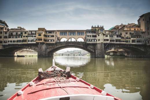 Arno Gondola Ride - A red gondola approaches Ponte Vecchio.