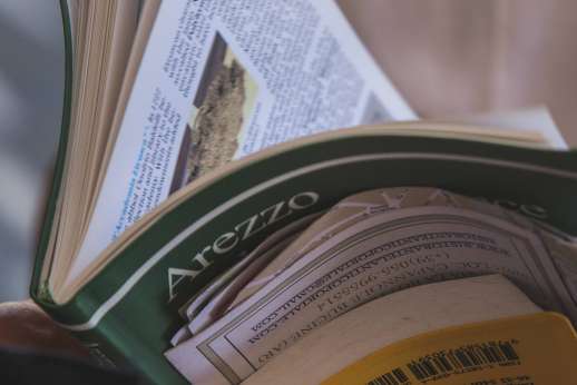 Arno Gondola Ride - A stack of opened guide books.