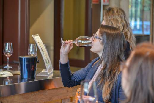 Chianti Wine Tour - A lady tastes a red wine as part of the wine tour