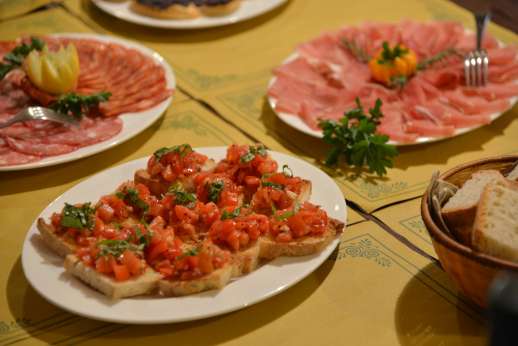 Fiat 500 Tour - A selection of traditional, Italian meats and breads are laid out on a table