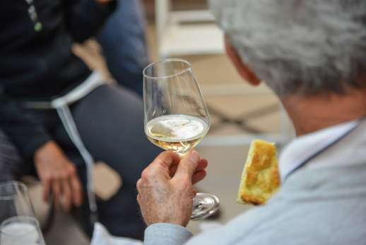 Lucca By Bike Or Foot - A tour group stop and enjoy Italian white wine and bread.