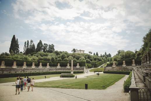 Pitti Palace & Boboli - Tourists view the stone statues in Boboli gardens.