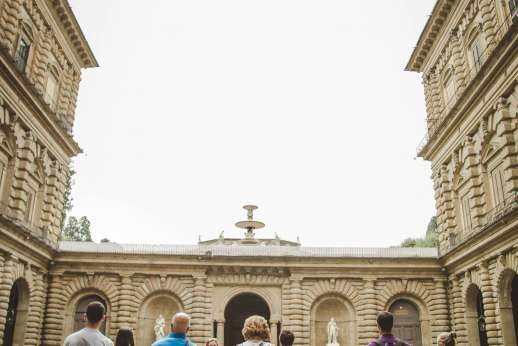 Pitti Palace & Boboli - Tourists take in a grand courtyard at Pitti Palace