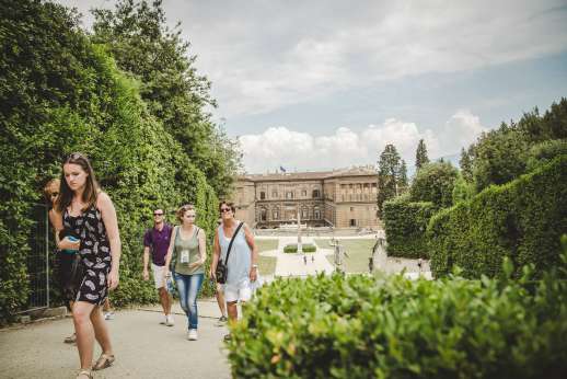 Pitti Palace & Boboli - A group of tourists walk from the palace through to Boboli gardens.