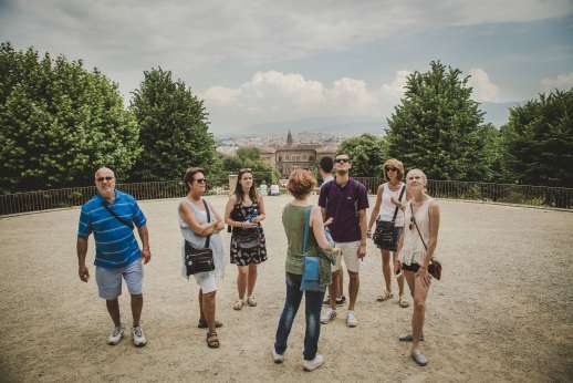 Pitti Palace & Boboli - A guide explains the history of Boboli gardens to a tour group.
