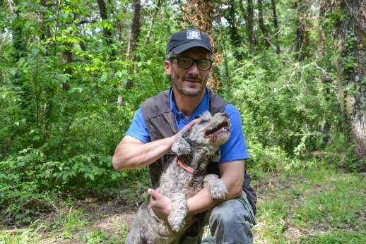 Truffle Hunting - A local guide and an Italian truffle dog before a truffle hunting