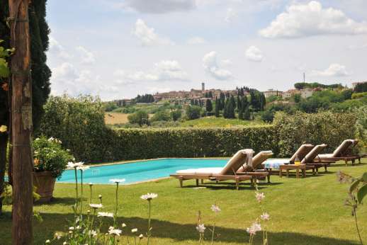 I Tre Cipressi - Lush lawns lead to the private salt water swimming pool, 5.5m x 11.5m/ 18 x 37 feet.