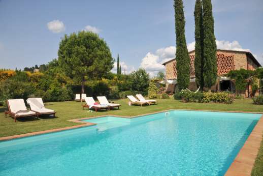 I Tre Cipressi - The pool and villa set in a hectare of olive and fruit trees along with a vegetable garden.