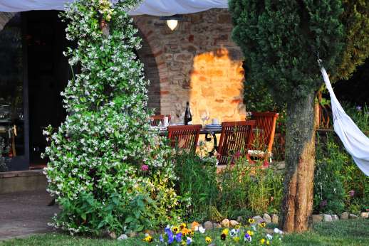 I Tre Cipressi - A view of the loggia from the large well kept garden.