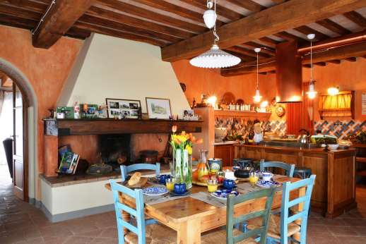 I Tre Cipressi - View of the large kitchen with fireplace.