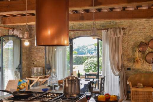 I Tre Cipressi - The kitchen leads outside to the outdoor dining area