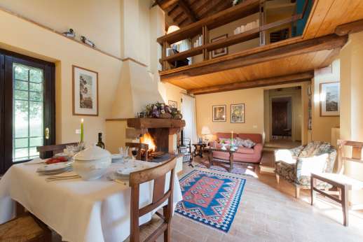 Il Cerro - The sitting, dining room with fireplace.