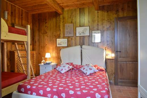 Il Chiesino - Double bedroom with French doors leading out to the garden.