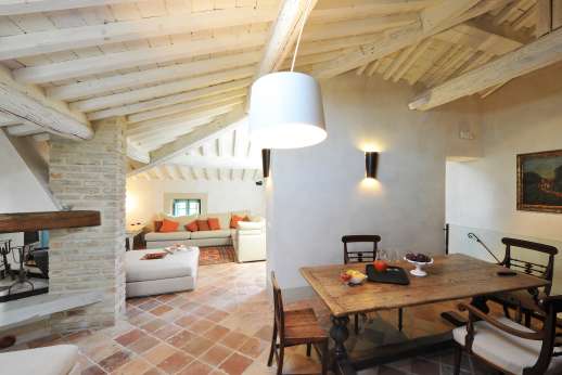 Il Cornello - Second floor mansarda, sitting room with TV and fireplace.