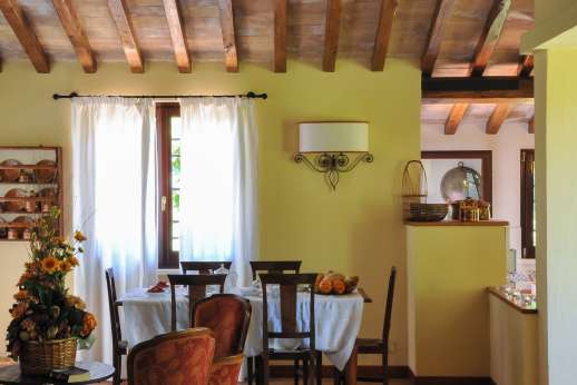 L'Olmo - View of the dining area, leading out to the portico for dining al fresco.