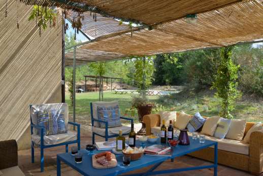 La Magione - Two large terraces lie immediately outside the house: one provides a shaded dining area.