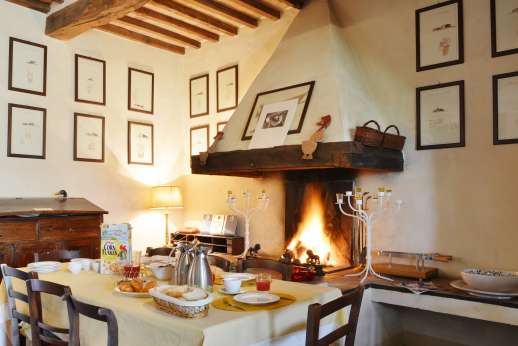 La Piana - Dining area with working open fireplace.