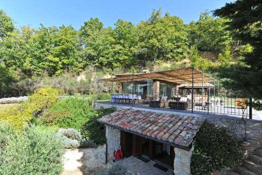 Le Gorgacce - View of the pool terrace with dining and lounging area.