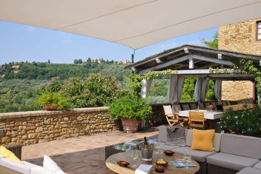Podere Celli - A picture-perfect Tuscan farmhouse, Podere Celli and its old stone walls blend beautifully into the vine covered hills of western Chianti.