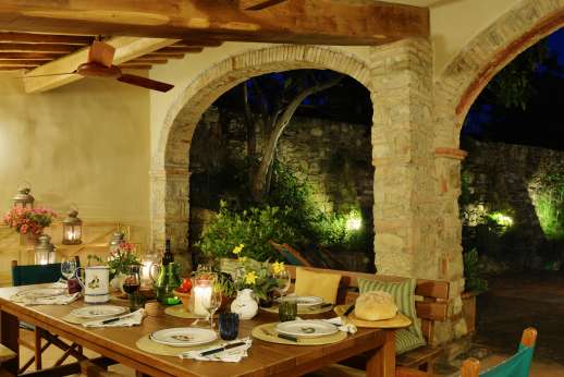 Podere Guicciardini - The large loggia in the court yard is full lit for enjoying your evening meals.