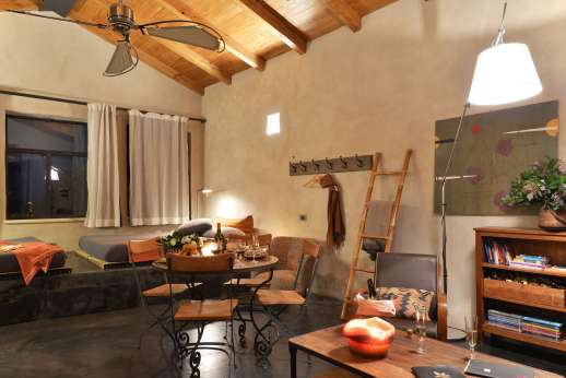 Santa Dieci - Guest house, sitting room with kitchenette.