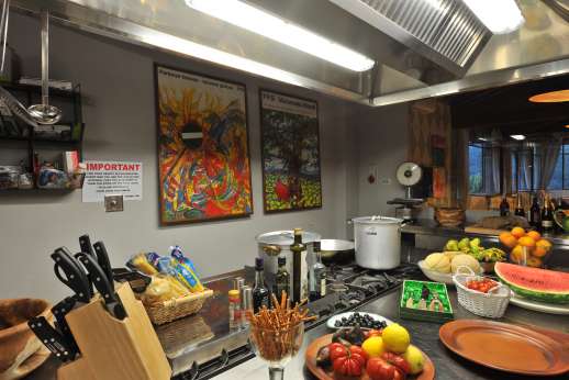 The Estate Of Petroio - The professional kitchen by the large open dining area of La Villa di Petroio