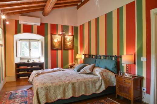 The Estate Of Petroio - First floor La Villa di Petroio double bedroom with air conditioning and en suite bathroom with bath