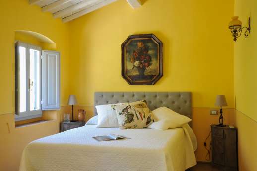 The Estate Of Petroio - Il Borgo di Petroio. Air- conditioned double bedrooms with an en suite bathroom.