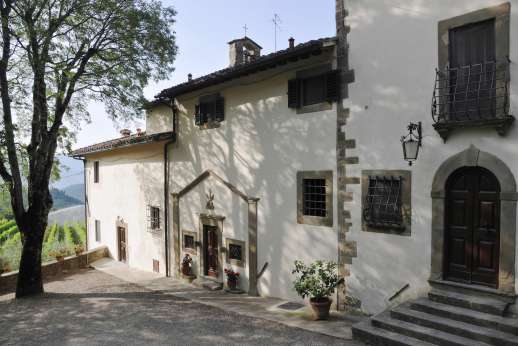 The Estate of Petroio with Staff and Cook - The entrance of the east guest wing and chapel to one side.
