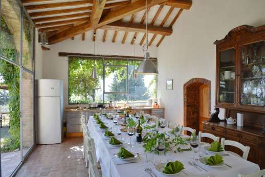 Tizzano - Well-illuminated dining room with table seating 18 and access to courtyard.