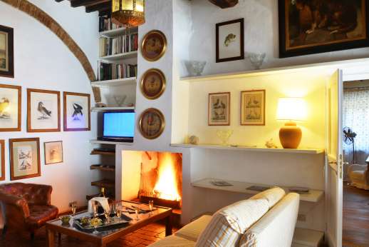 Tizzano - First floor, TV room with fireplace.