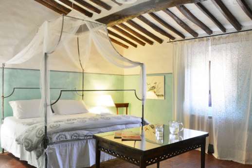 Tizzano - Ground floor independent suite double bedroom with elegant furnishings.