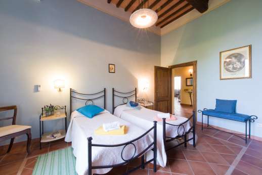 Villa Astori - Air conditioned twin bedroom with en suite bathroom.