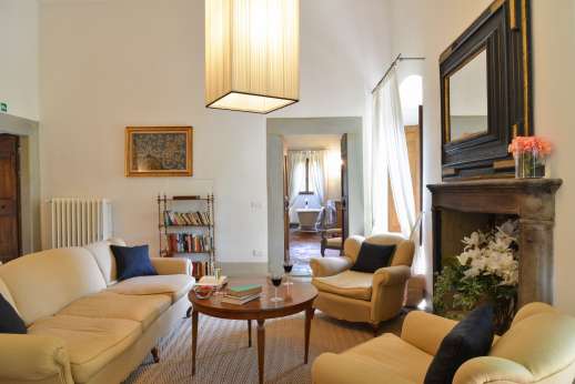 Weddings at Villa Di Masseto - First floor up 21 stone steps to a sitting room with fireplace.