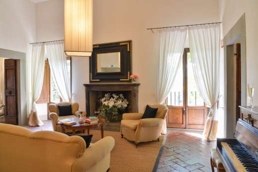 Weddings at Villa Di Masseto - First floor up 21 stone steps to a sitting room with fireplace.