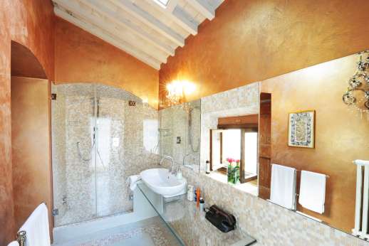 Weddings at Villa Di Masseto - One of the stylish bathrooms with shower and elegantly mosaicked walls.