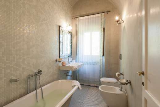 Weddings at Villa Di Masseto - Bathroom with bath and beautiful white mosaics.